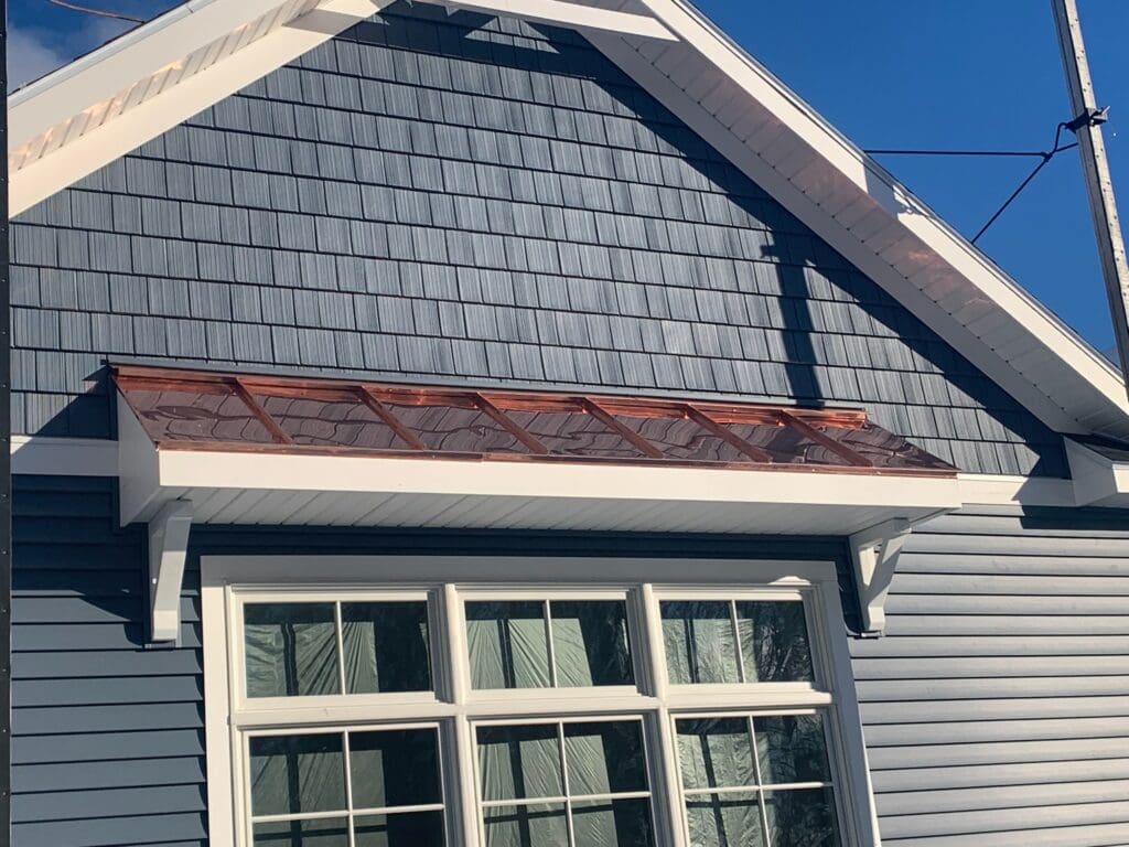 New residential house build with copper roofing on the awning