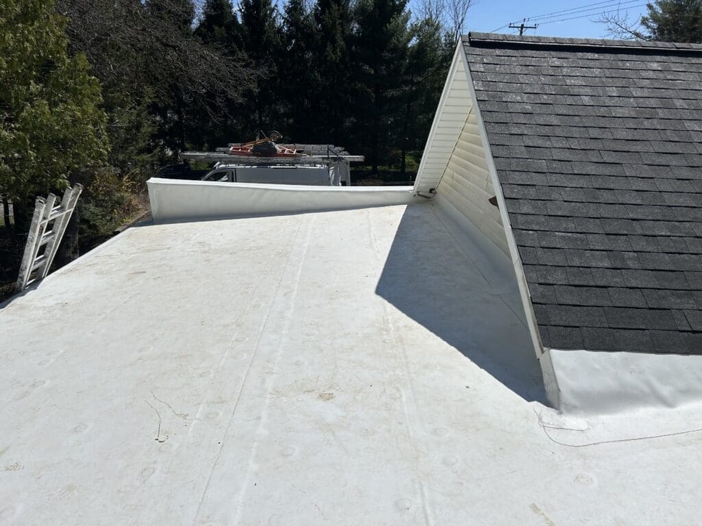 Residential flat roof with rubber roofing such as EPDM or TPO