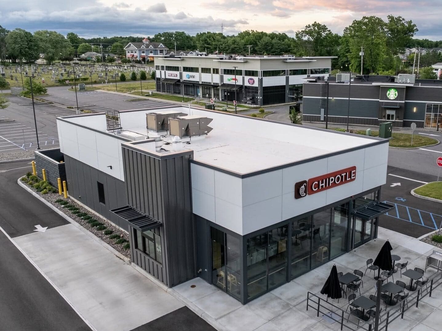 Aerial view of a new Chipotle building in Malta New York, highlighting the PVC Membrane flat roofing system completed by KC Entities Roofing and Siding