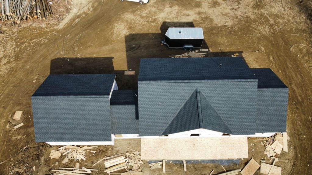 New home with roof installed by KC Entities Roofing and Siding with GAF Charcoal asphalt shingles