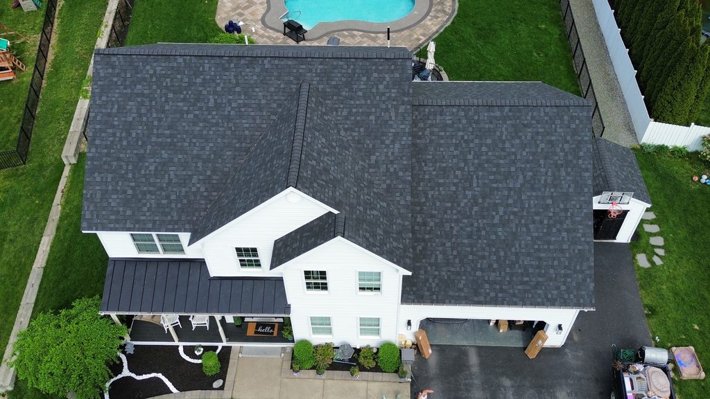 Home with roof replacement completed by KC Entities Roofing and Siding with Owens Corning Onyx Black asphalt shingles