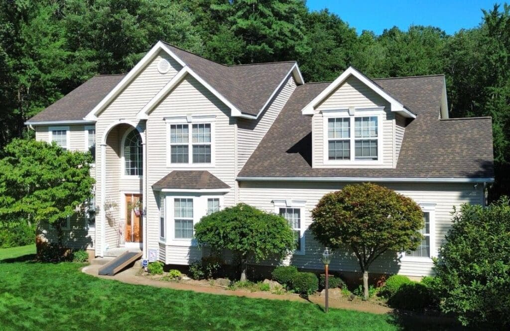 Home with roof replacement completed by KC Entities Roofing and Siding with GAF Chestnut Valley asphalt shingles